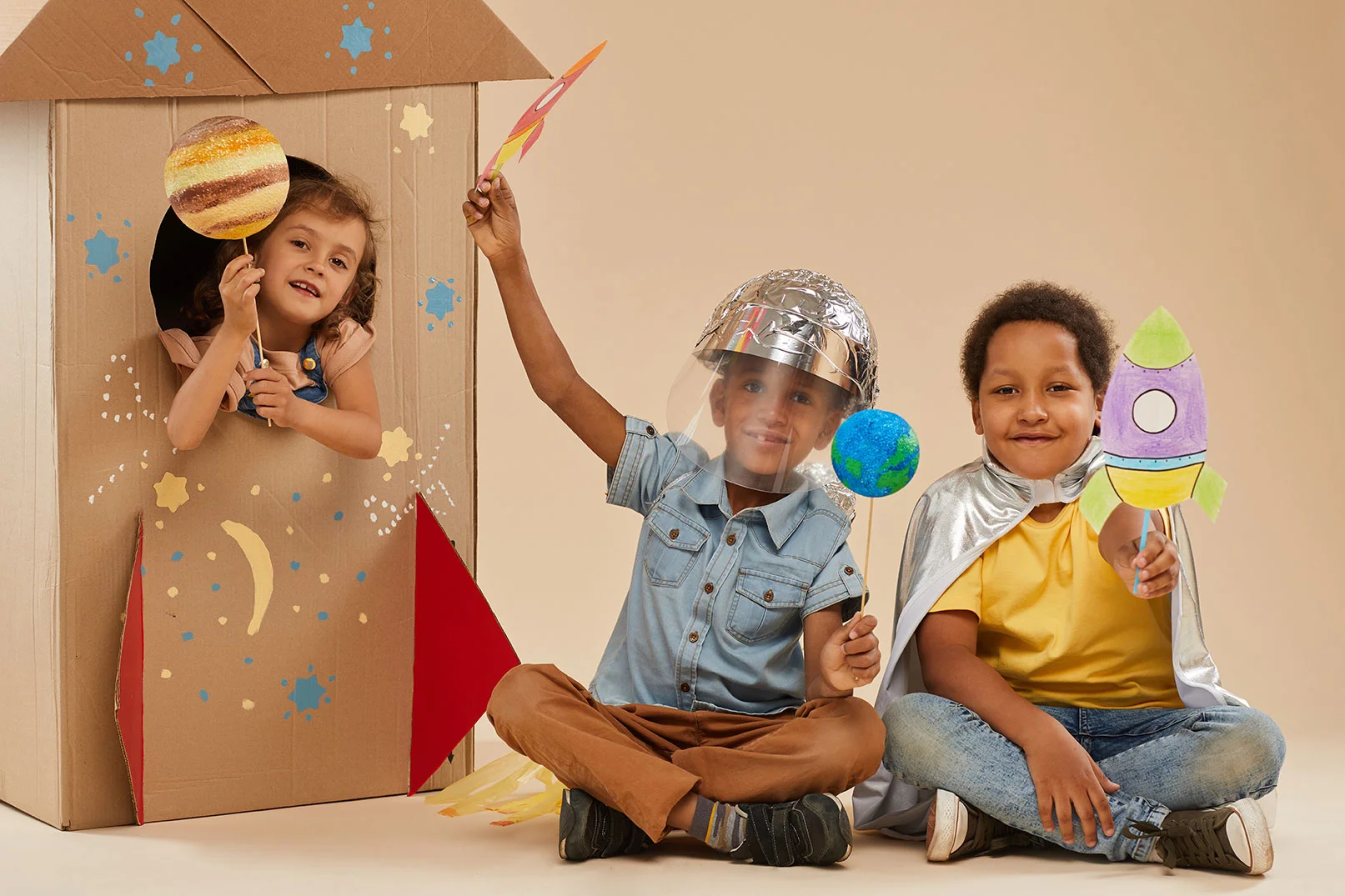 kids playing dress up as spacemen